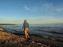 Walking in nylon tights on the beach