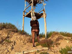 Legs in tights and a big ass tease you on a deserted seashore to the sounds of the sea breeze