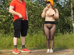 An amateur girl in seamless pantyhose masturbates a passerby, her body bent over, her ass in the air, until he comes on her.